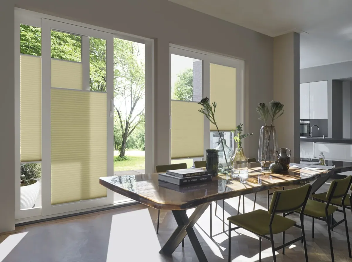 Duette honeycomb cellular blinds fitted to patio doors and windows in a dining room
