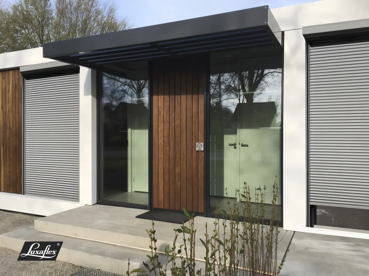 External aluminium roller shutters on the windows of a modern home