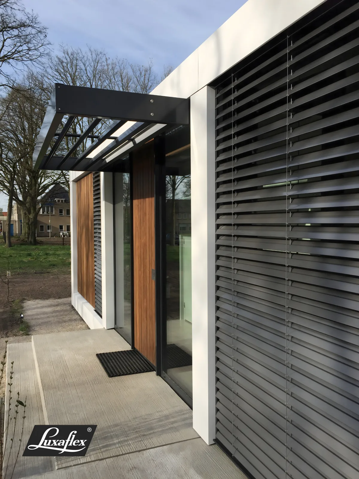 External aluminium Venetian blinds shading a modern house facade
