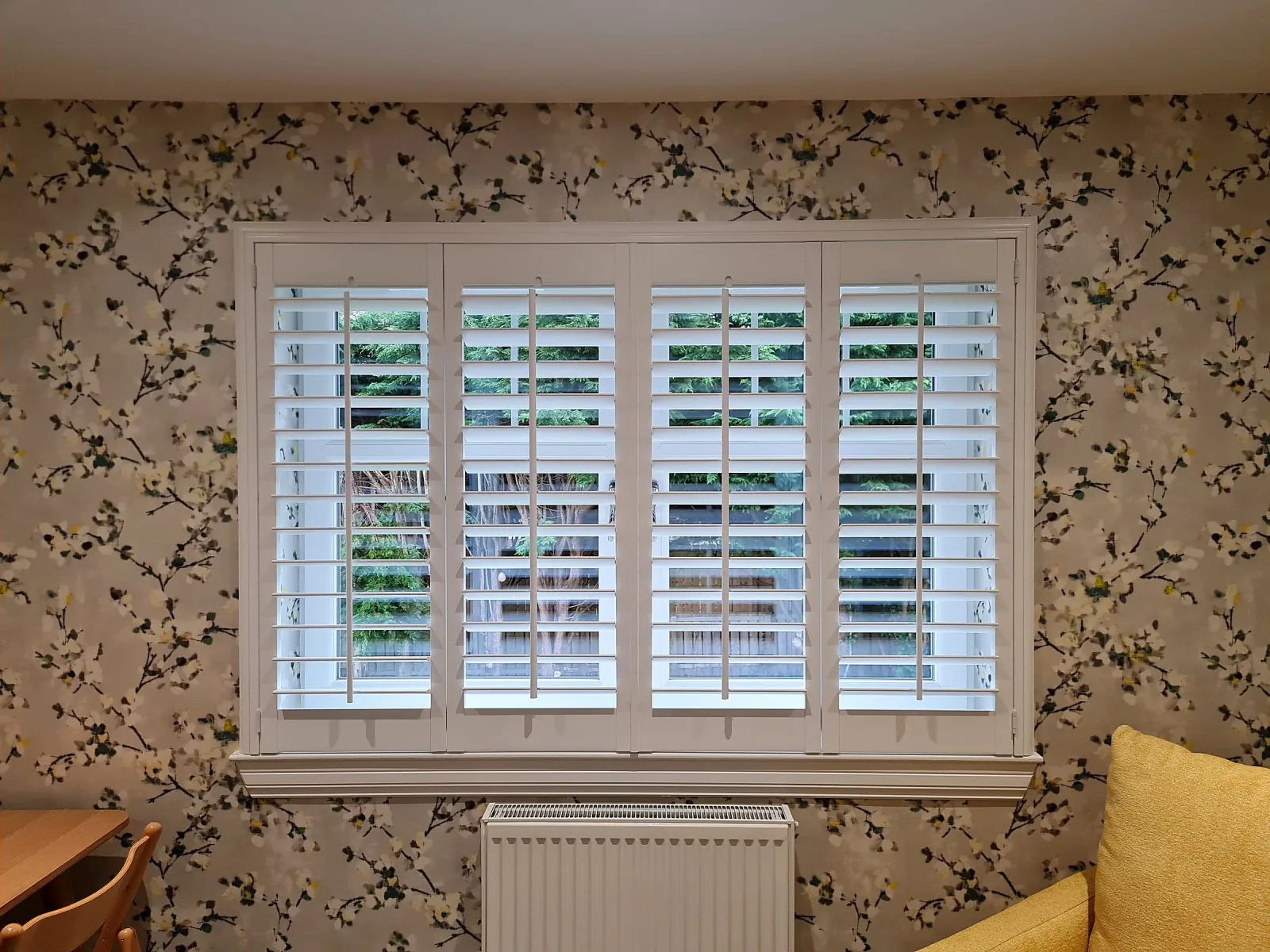 Full height interior wooden shutters in a Scottish room