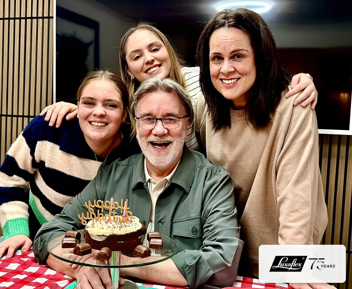 David Browne celebrating his 75th birthday with daughter Judith and granddaughters Olivia and Chloe, cake on the table