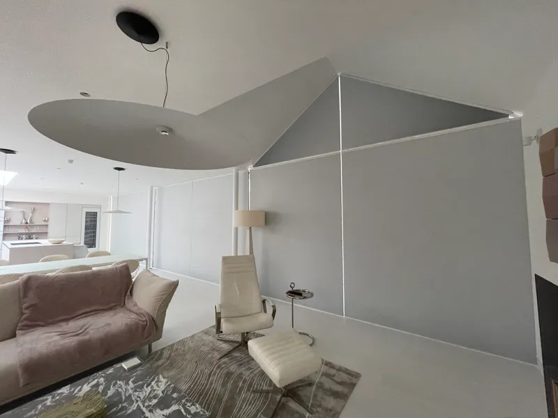 Motorised gable cellular blind fitted to an angled window